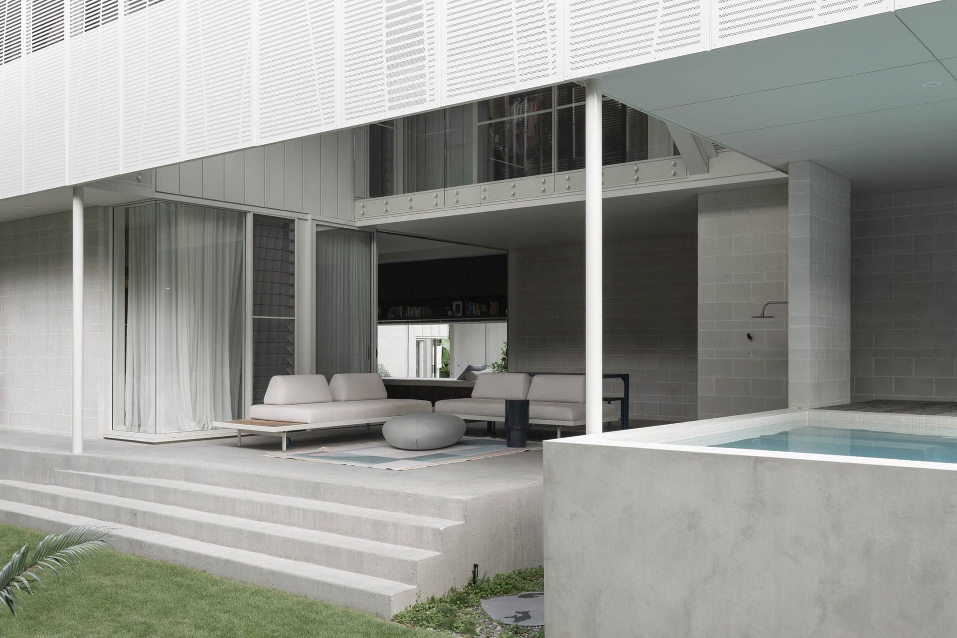 Eleutheria - Patio. Outdoor living area opening onto the lawn.