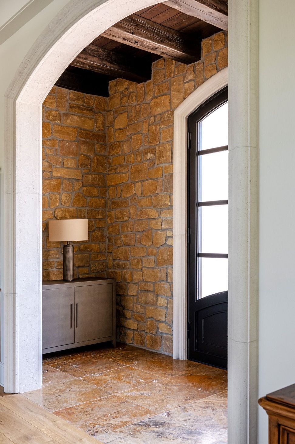 french-countryside-interior-stone-wall-arch.jpg