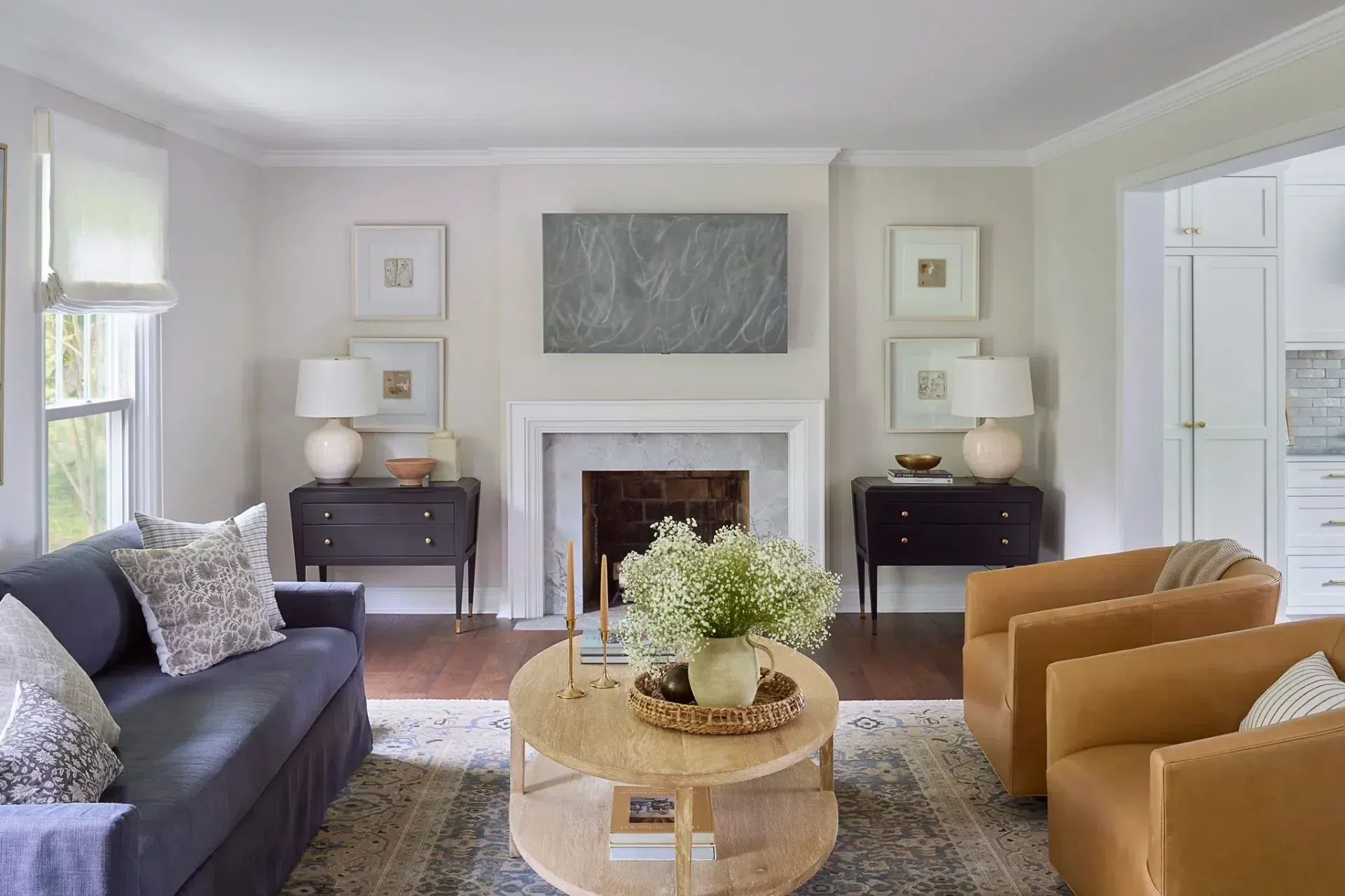 living-room-renovation-interior-design-modern-farmhouse-furnishings-leather-chairs-grey-sofa-decorative-pillows-sharp-and-grey-interiors-philadelphia-pa.webp