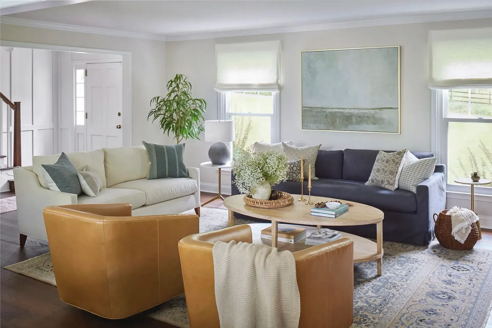 living-room-renovation-interior-design-modern-farmhouse-furnishings-leather-chairs-grey-sofa-sharp-and-grey-interiors-philadelphia-pa.webp