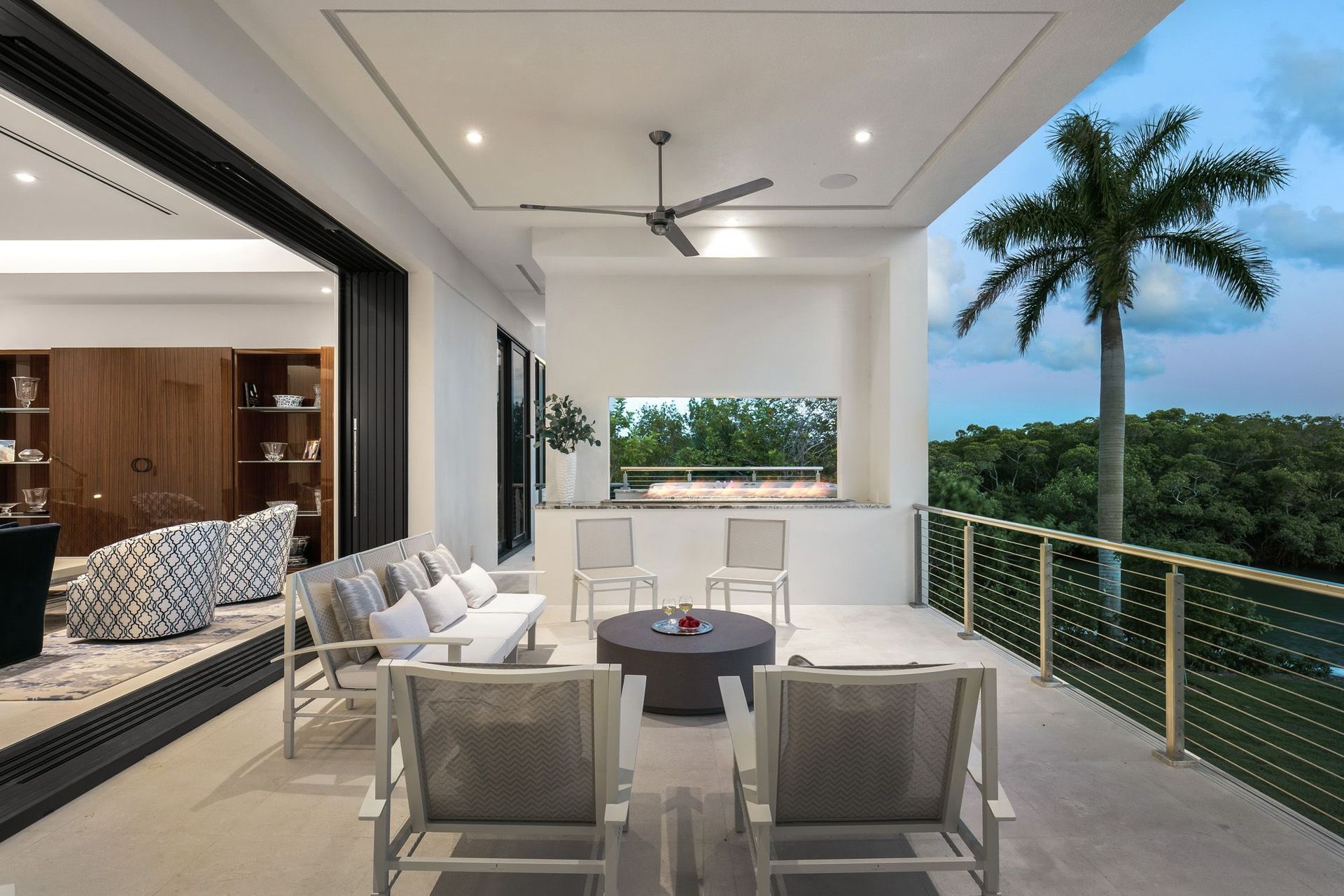 sarasota-waterfront-modern-outdoor-seating-fireplace.jpg