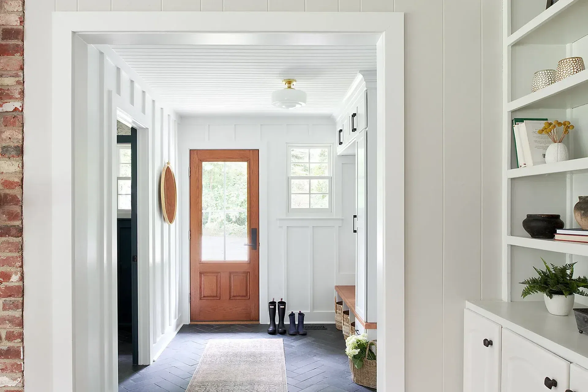 sharpandgreyinteriors-philadelphia-entryway-mudroom-renovation-herringbone-slate-tiles-built-ins.webp
