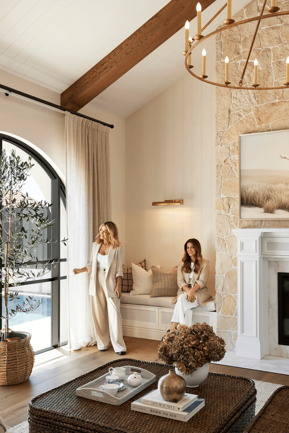 alisa-and-lysandra-brighton-bungalow-fireplace-arched-windows-sheer-curtains-67a02f2eaf2b7.png
