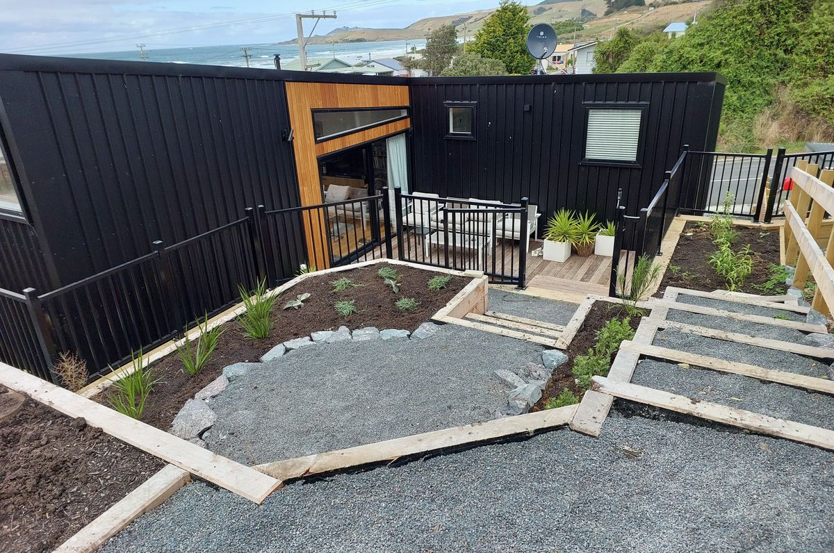 Maximising space and views on small, steep seaside section