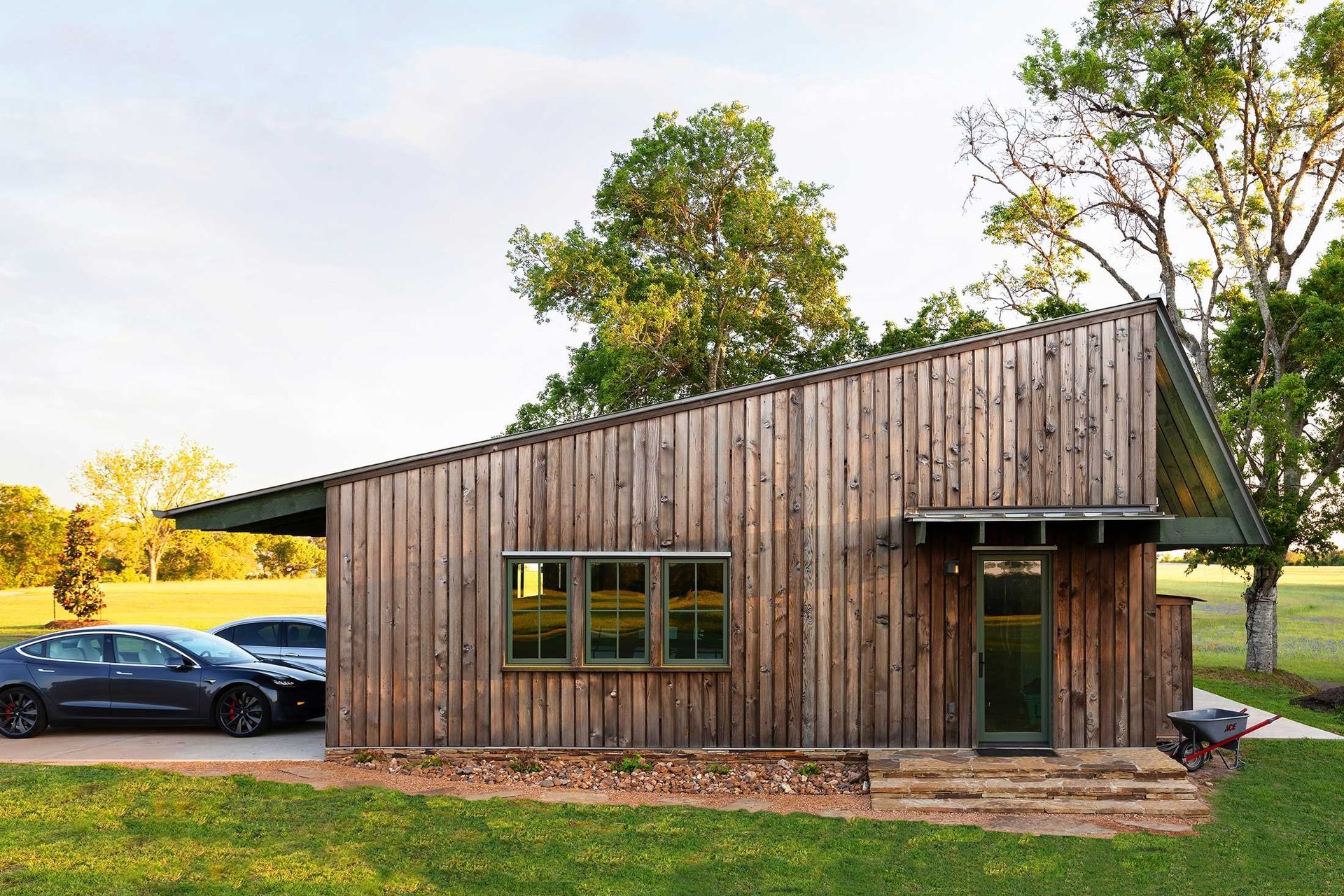 19HomeontheRangeCuppettKilpatrickArchitectureandInteriorDesigndetached-garage-wooden-siding-metal-roof.jpg