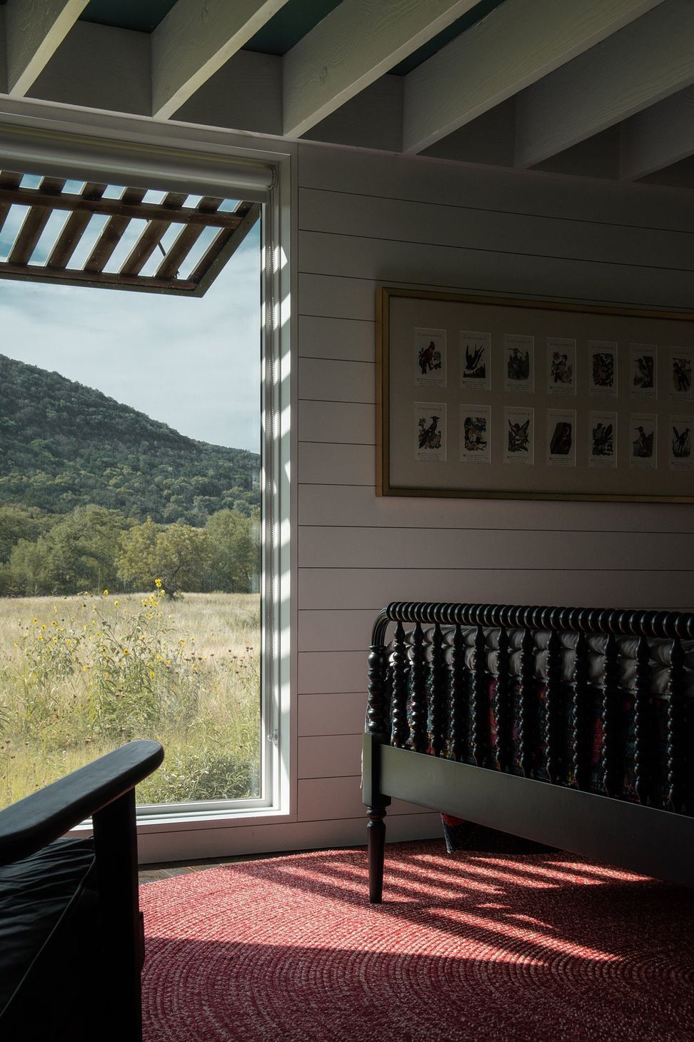 22CampFrioCuppettKilpatrickArchitectureandInteriorDesignbedroom-hillside-view-spindle-bed.jpg