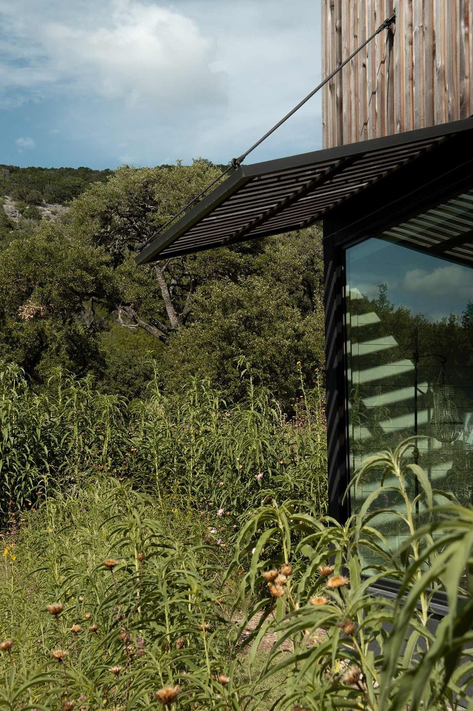 23CampFrioCuppettKilpatrickArchitectureandInteriorDesignbuilding-window-awning-natural-surroundings.jpg
