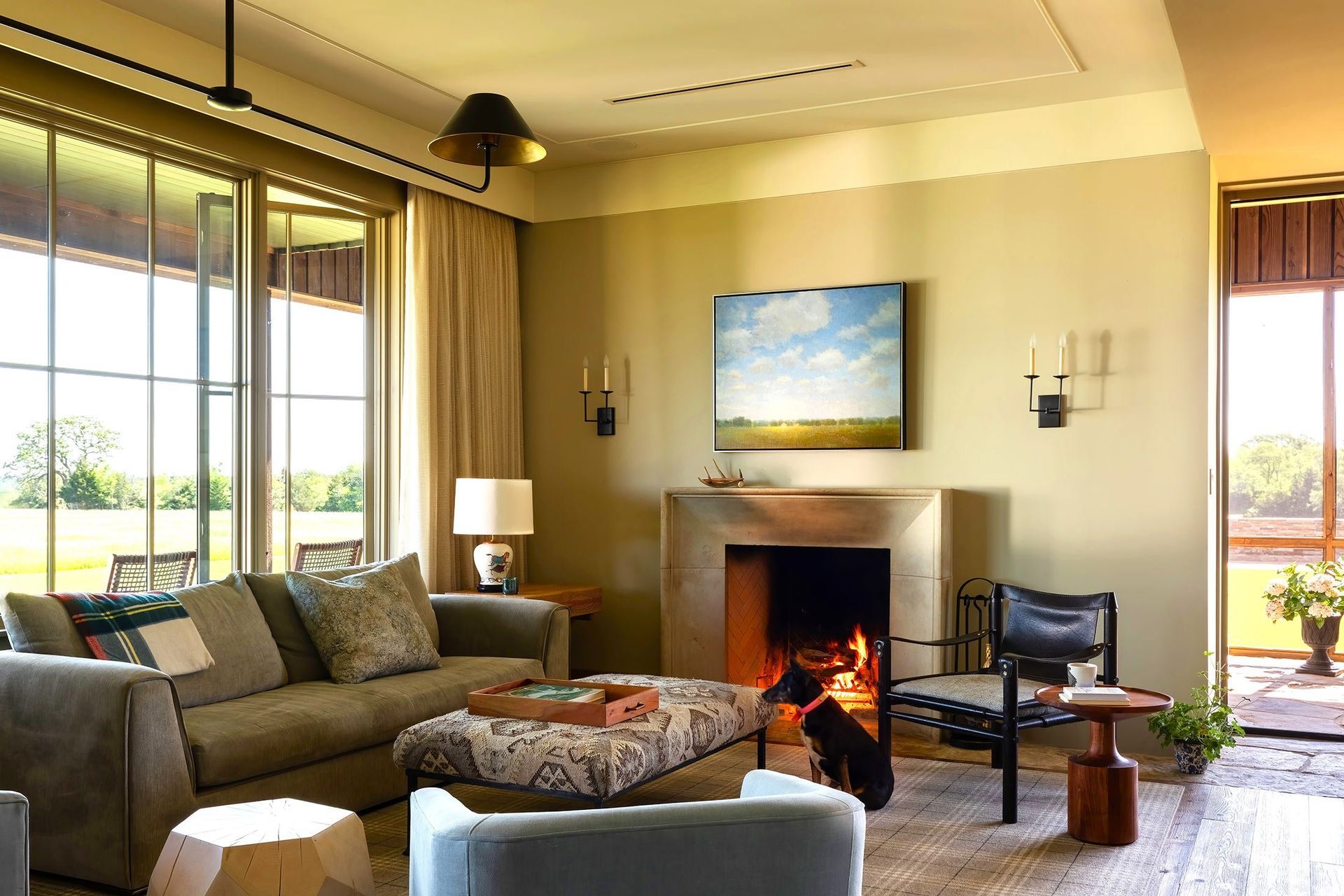 8HomeontheRangeCuppettKilpatrickArchitectureandInteriorDesigngray-sofa-stone-fireplace-hardwood-floor.jpg