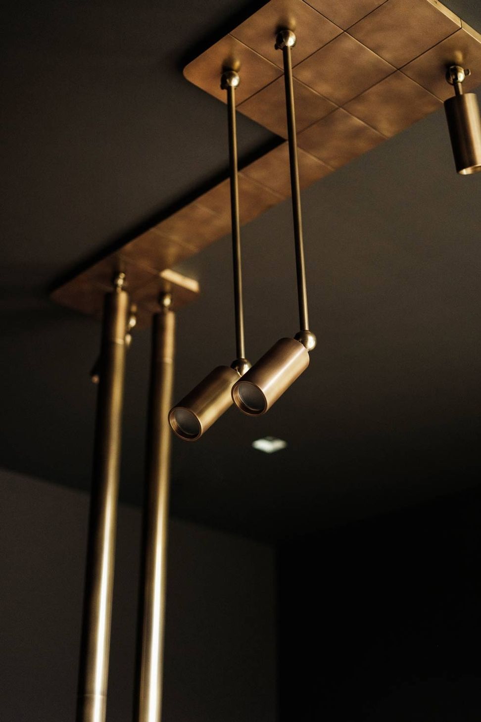 imgi7custom-brass-light-fixture-by-apparatus-in-moody-modern-office-design.jpg