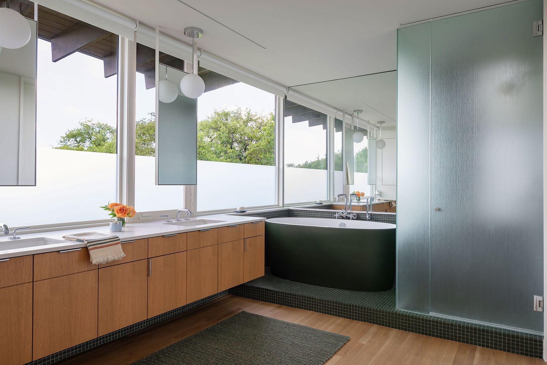 15WoodlandRetreatCuppettKilpatrickArchitectureandInteriorDesignmodern-bathroom-wooden-cabinetry-green-tub.jpg