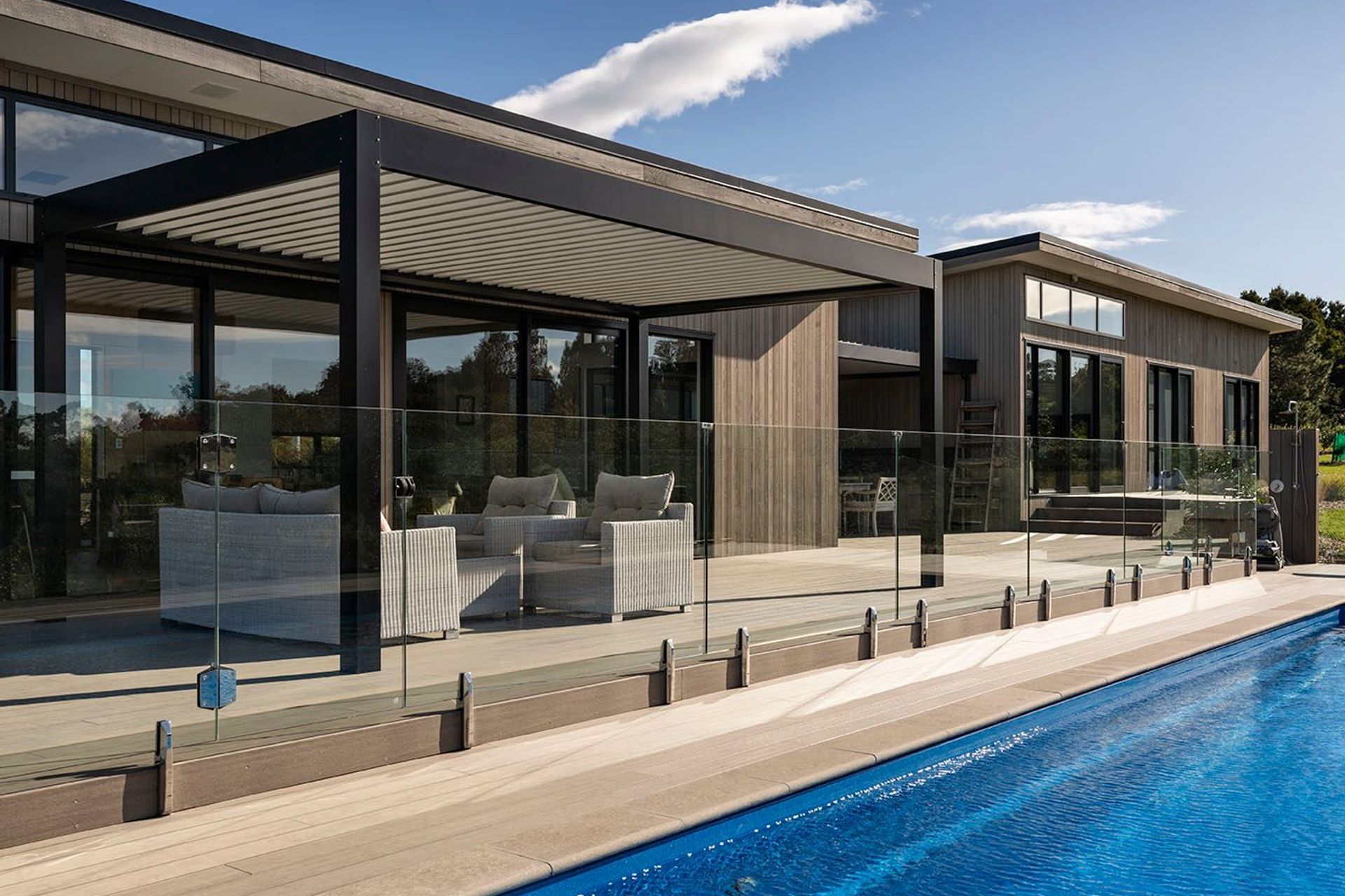 Pool area creates a heroic glimpse of the building and its clean lines