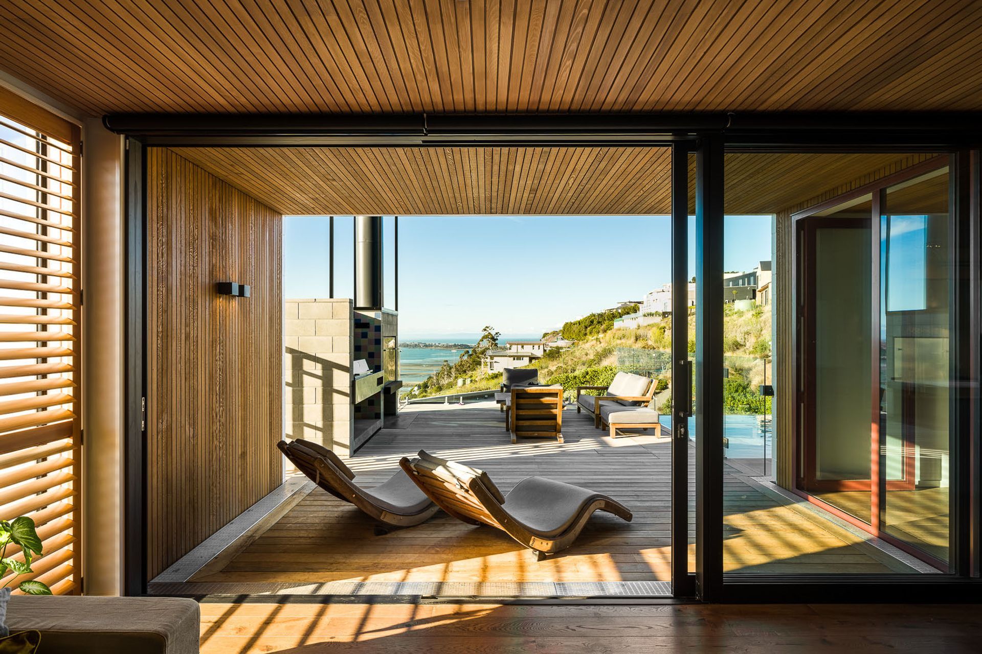 The living areas and outdoor spaces have been recessed into the building line to mitigate solar gain. The deep overhangs also help to frame the view, creating vignettes from every room.