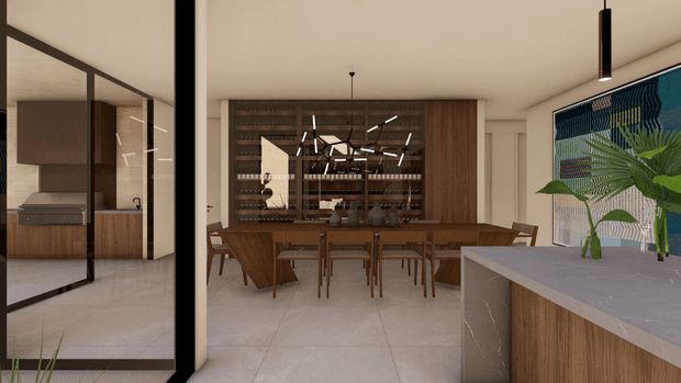 Contemporary open-plan dining and kitchen interior viewed through a black-framed glazed partition. The space features a large timber dining table with matching chairs, extensive dark timber wall cabinetry and shelving, a stone-topped kitchen island in the foreground, pale large-format tiled flooring, pendant lighting, and a bold blue patterned feature wall with tropical planting.