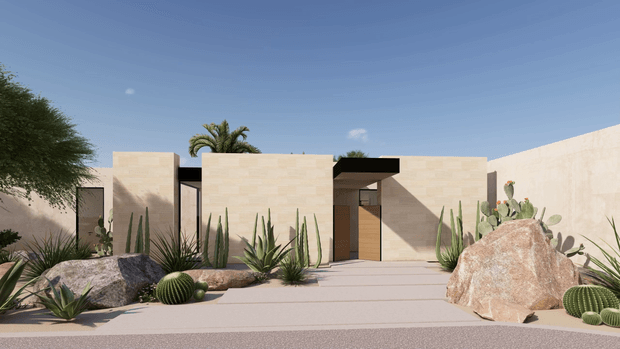 Single-storey minimalist desert residence with flat-roofed, pale stone or stucco-clad cubic volumes surrounding a recessed timber entry. A broad paved approach is landscaped with drought-tolerant cacti, agaves, succulents, palms, and large natural boulders under a clear blue sky.