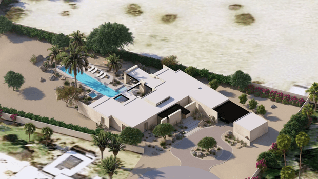 Aerial architectural rendering of a sprawling contemporary single-storey residence arranged around landscaped courtyards and a long swimming pool. The home has crisp white and pale rendered walls, broad flat roof planes, dark recessed roof sections, extensive glazing, a curved driveway, and lush palm and shrub planting within a walled site.