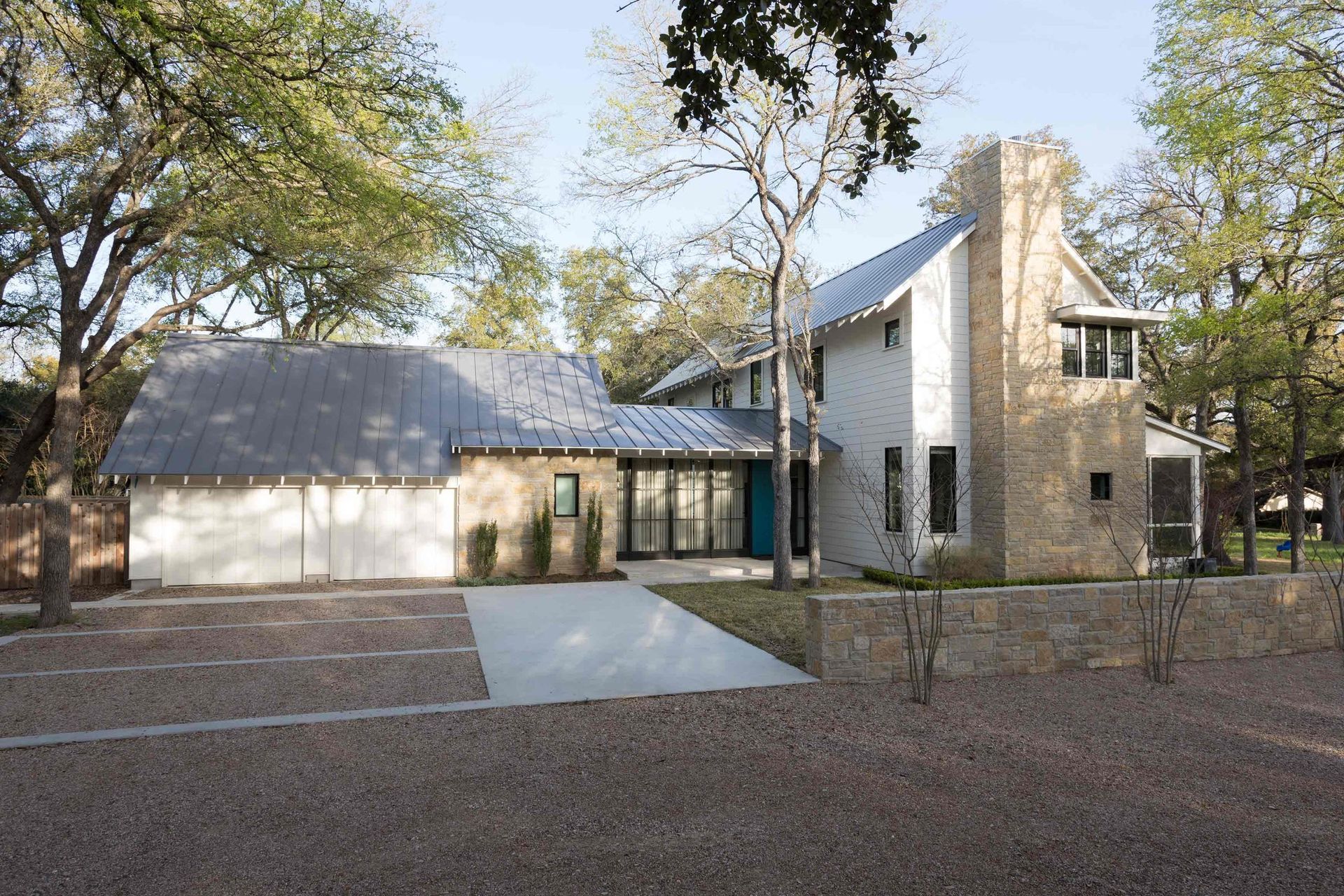 02BunnyRunCuppettKilpatrickArchitectureandInteriorDesignaustin-tx-modern-farmhouse-composition-stone-metal-roof.jpg