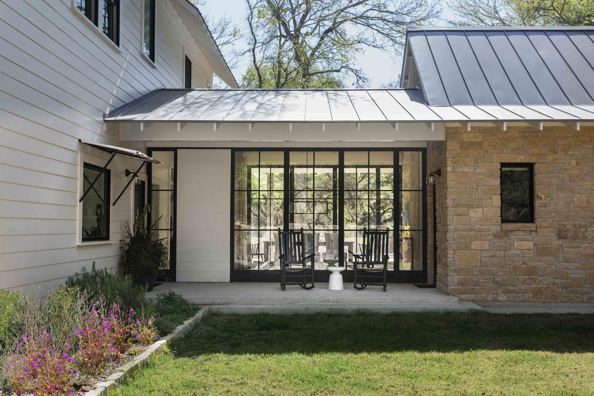 06BunnyRunCuppettKilpatrickArchitectureandInteriorDesignaustin-tx-entry-bridge-steel-windows-backyard-porch.jpg