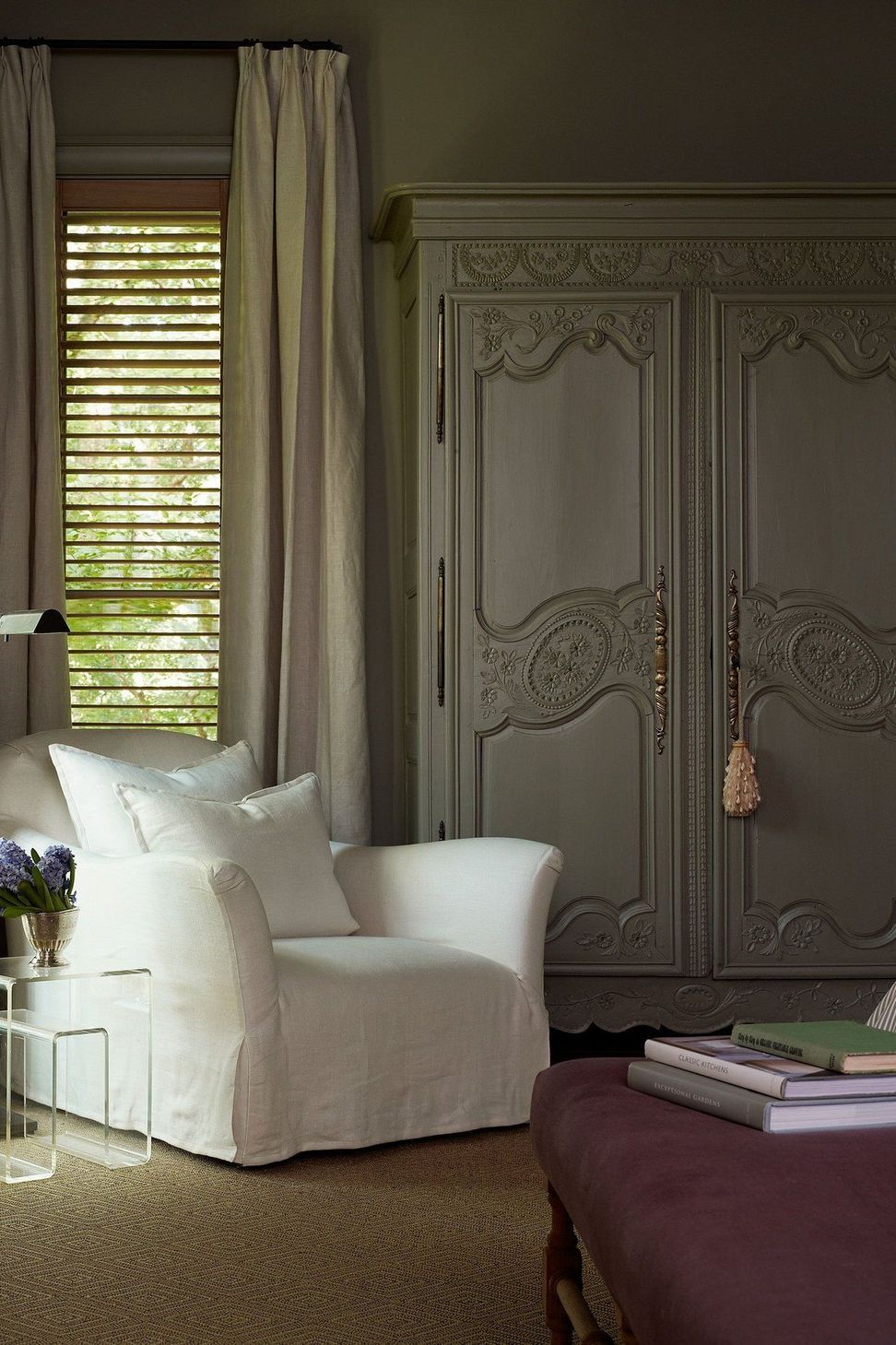 14UrbanHomesteadCuppettKilpatrickArchitectureandInteriorDesignaustin-tx-austin-tx-main-bedroom-vintage-wardrobe-sitting-chair-1.jpg