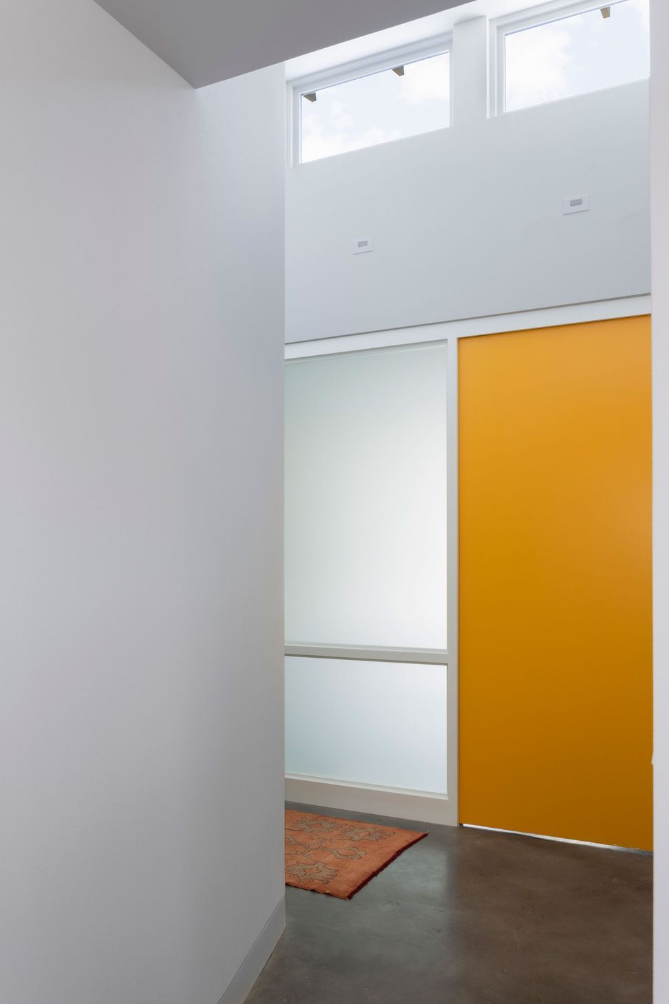 9RiverRoadCuppettKilpatrickArchitectureandInteriorDesignaustin-tx-playroom-entry-yellow-sliding-door-frosted-glass.jpg